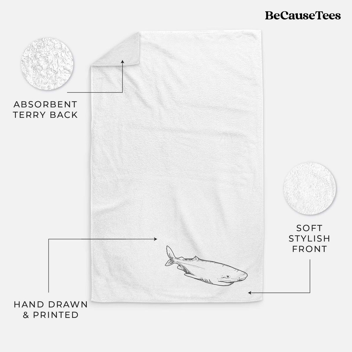 White hand towel printed with a black ink illustration of a Greenland shark swimming.