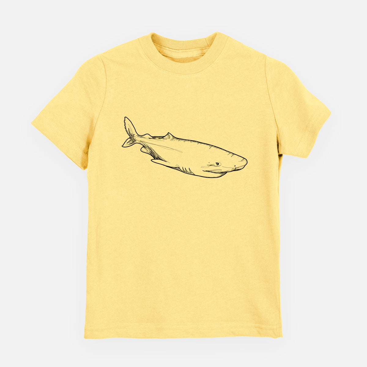 Butter yellow youth t-shirt laid flat, printed with a black ink illustration of a Greenland shark swimming.