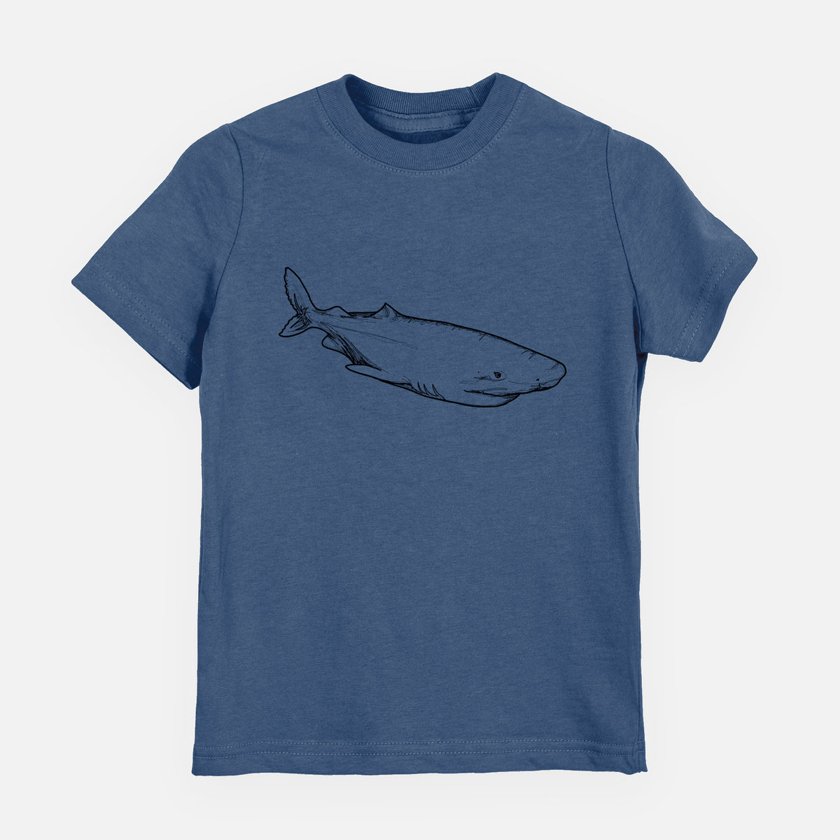 Indigo blue youth t-shirt laid flat, printed with a black ink illustration of a Greenland shark swimming.