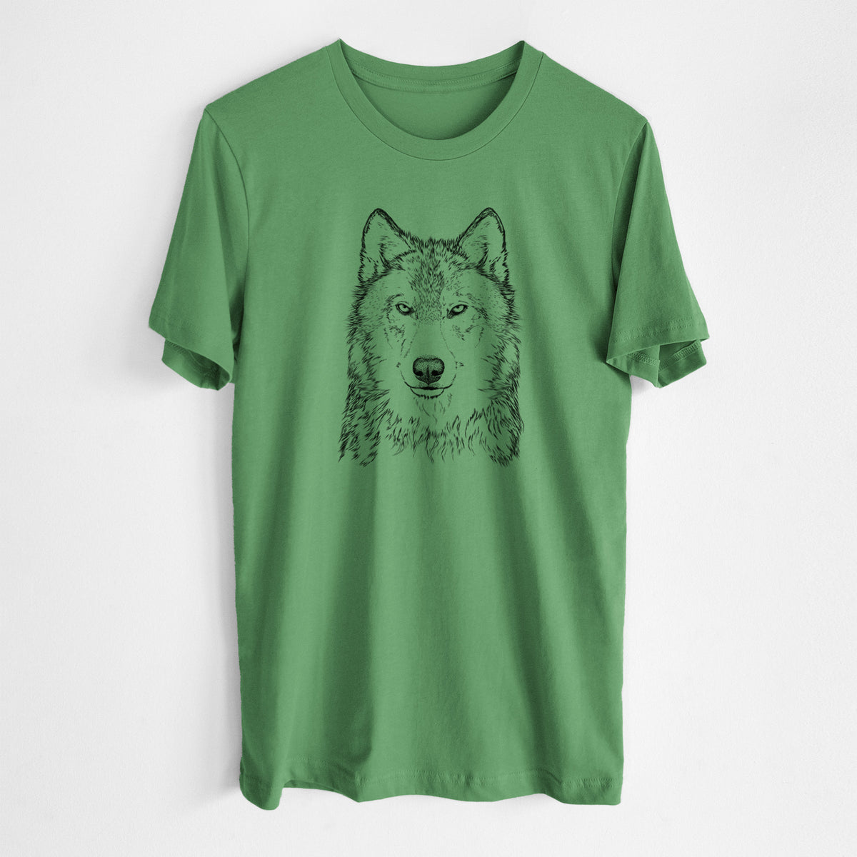 Leaf green lightweight cotton t-shirt laid flat, printed with a detailed black ink portrait of a grey wolf facing forward.