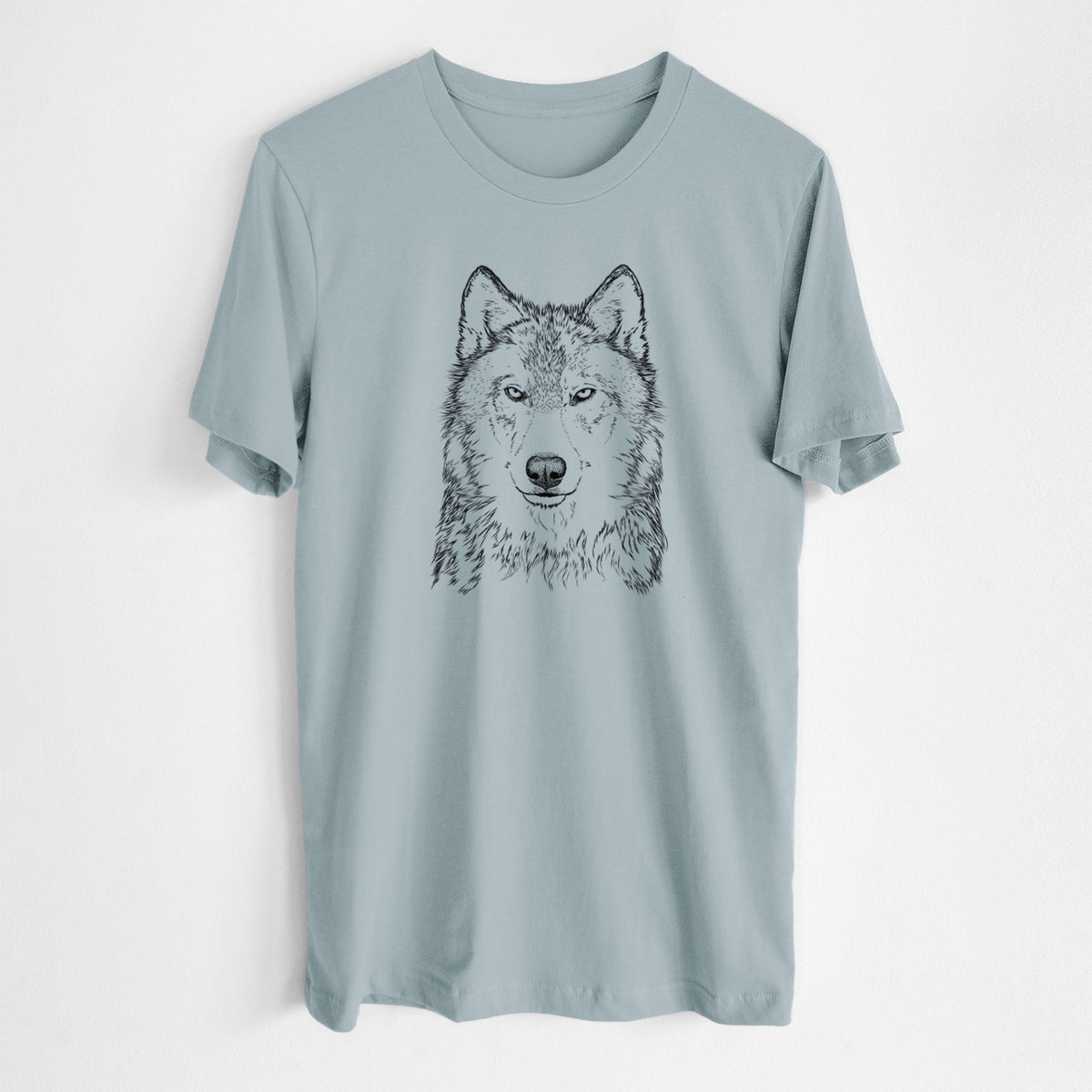Vintage denim lightweight cotton t-shirt laid flat, printed with a detailed black ink portrait of a grey wolf facing forward.