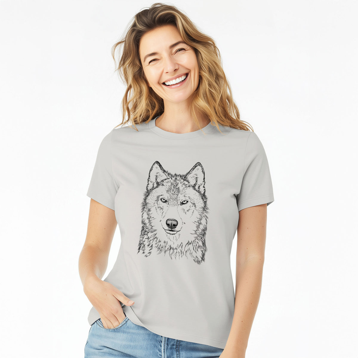 Woman wearing a lunar grey women's relaxed fit cotton t-shirt printed with a detailed black ink portrait of a grey wolf facing forward.