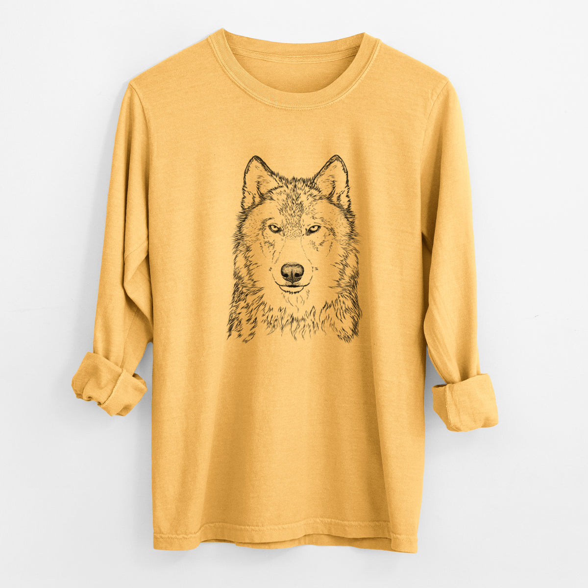 Golden wheat yellow Comfort Colors long sleeve shirt laid flat with the cuffs rolled, printed with a detailed black ink portrait of a grey wolf facing forward.