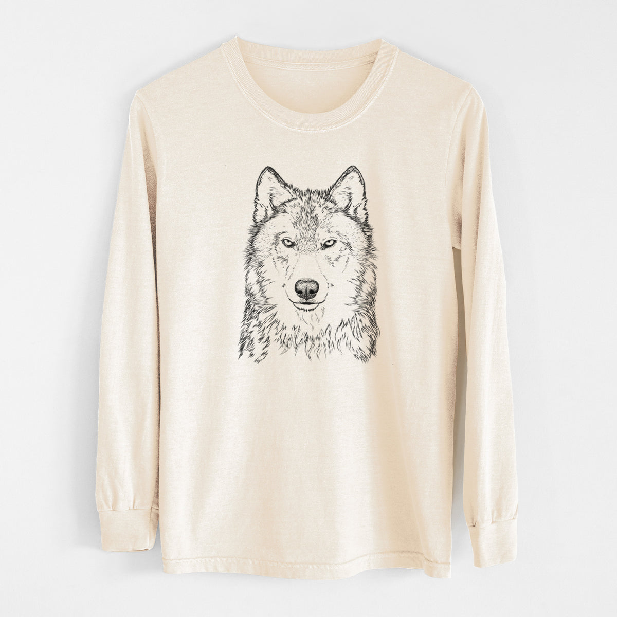 Ivory Comfort Colors long sleeve shirt laid flat, printed with a detailed black ink portrait of a grey wolf facing forward.