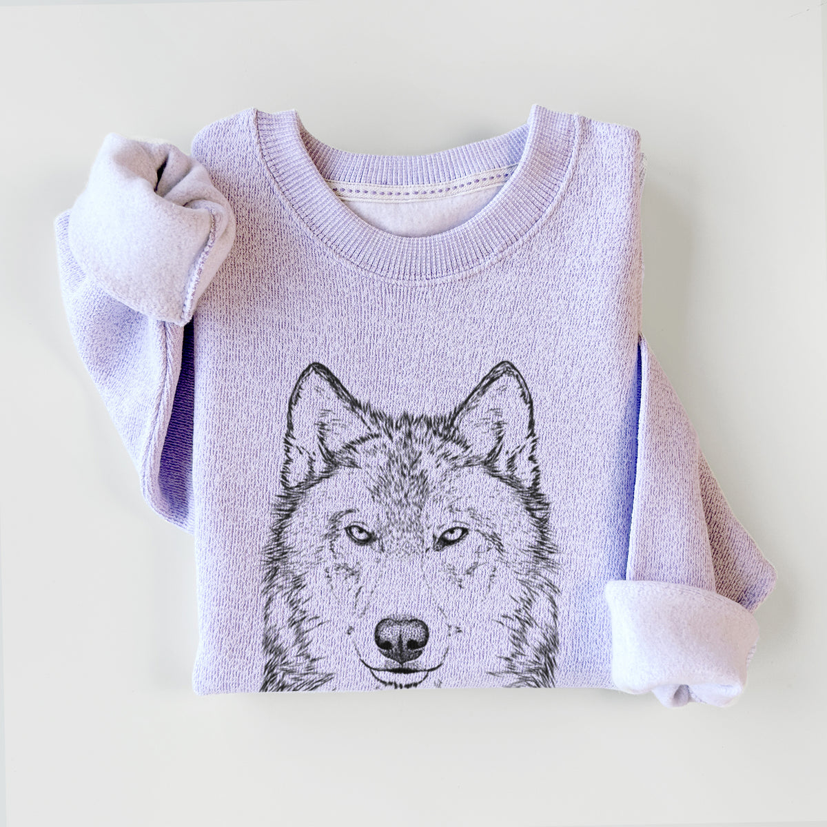Ice purple knit sweatshirt printed with a detailed black ink portrait of a grey wolf facing forward, styled flat.