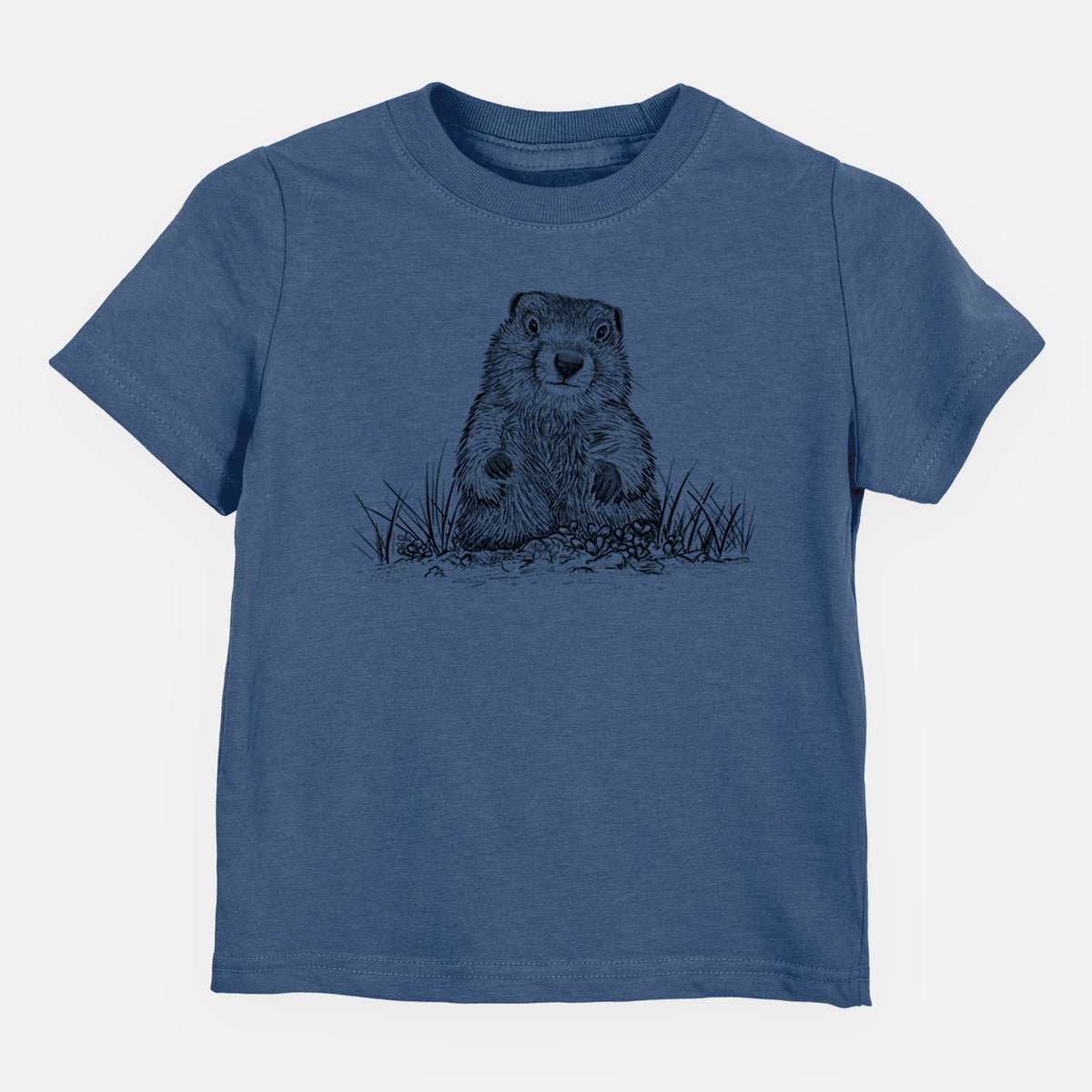 Indigo blue toddler t-shirt laid flat, printed with a black ink illustration of a groundhog peeking out of its burrow among grass.