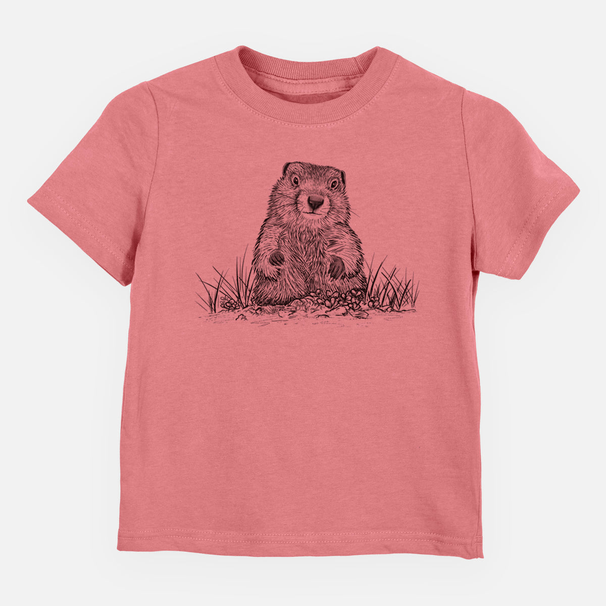 Mauve pink toddler t-shirt laid flat, printed with a black ink illustration of a groundhog peeking out of its burrow among grass.