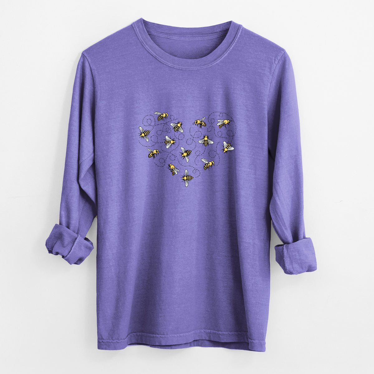 Violet purple Comfort Colors long sleeve shirt laid flat with the cuffs rolled, printed with a heart shape made of small bees and looping flight trails.