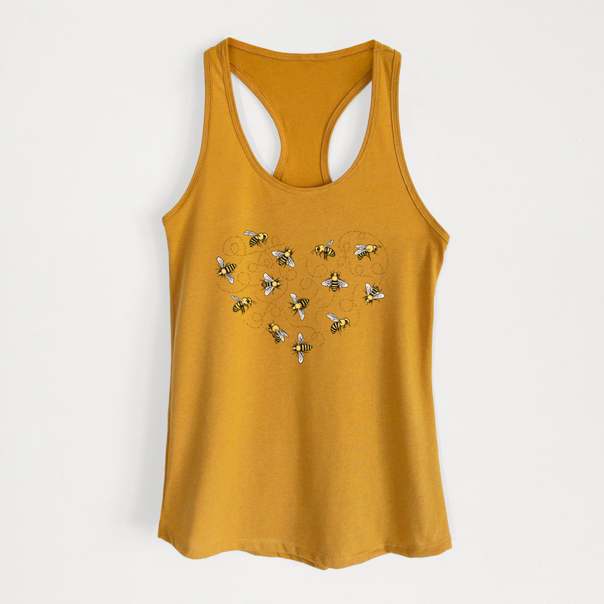 Gold women's racerback tank top laid flat, printed with a heart shape made of small bees and looping flight trails.