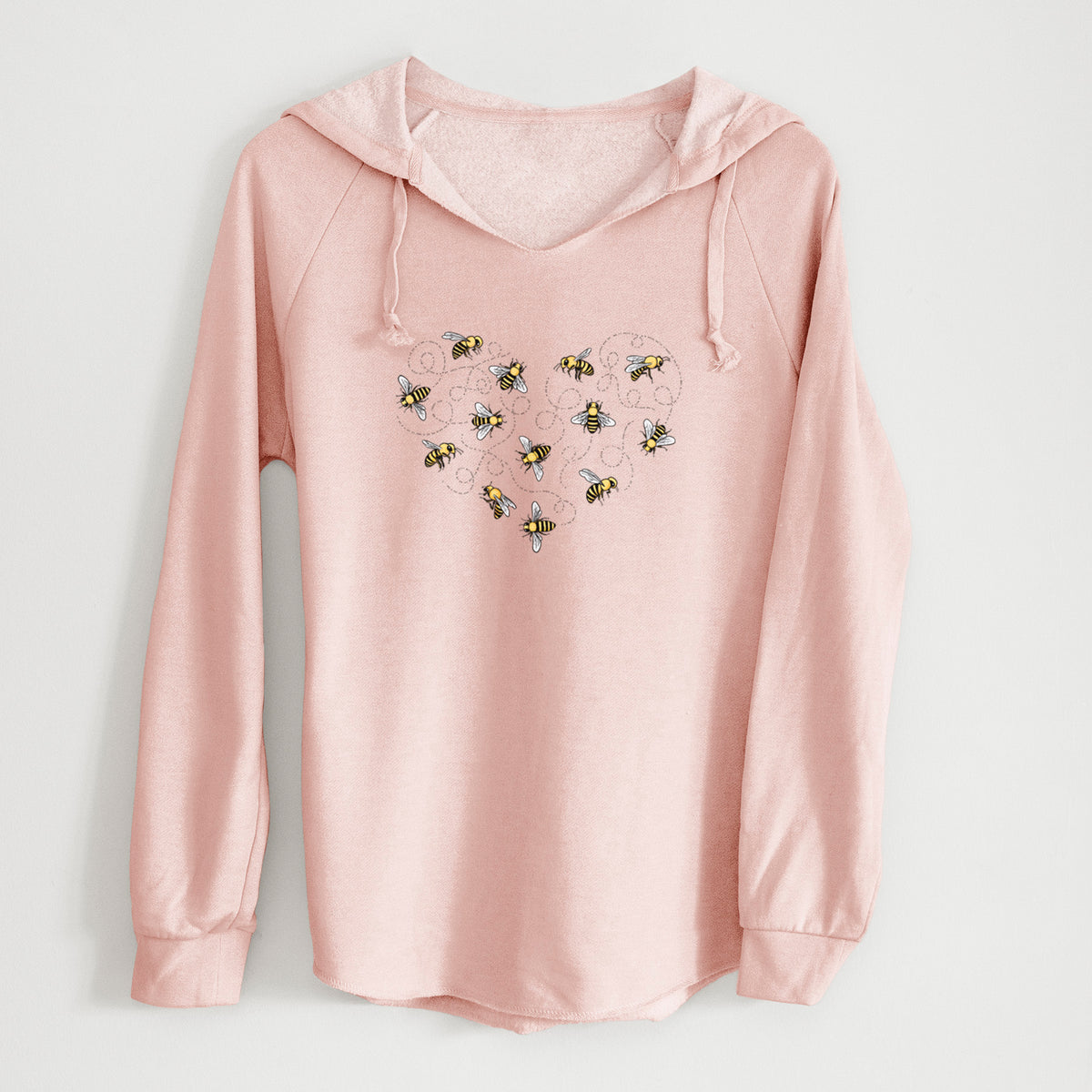 Blush pink women's Cali Wave hooded sweatshirt laid flat, printed with a heart shape made of small bees and looping flight trails.