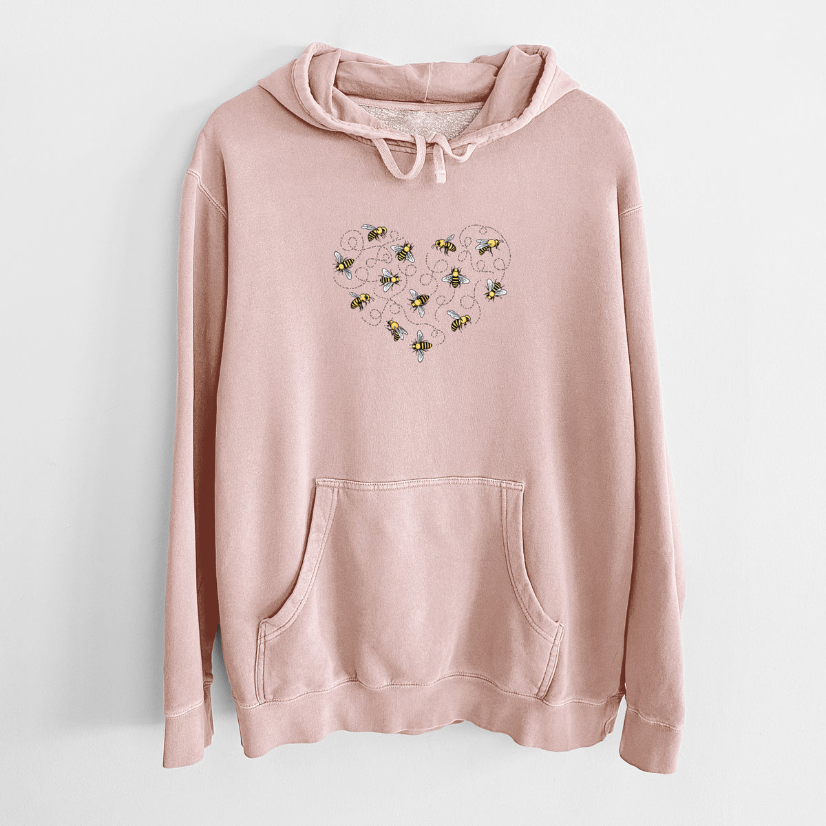 Dusty pink pigment dyed hoodie laid flat, printed with a heart shape made of small bees and looping flight trails.