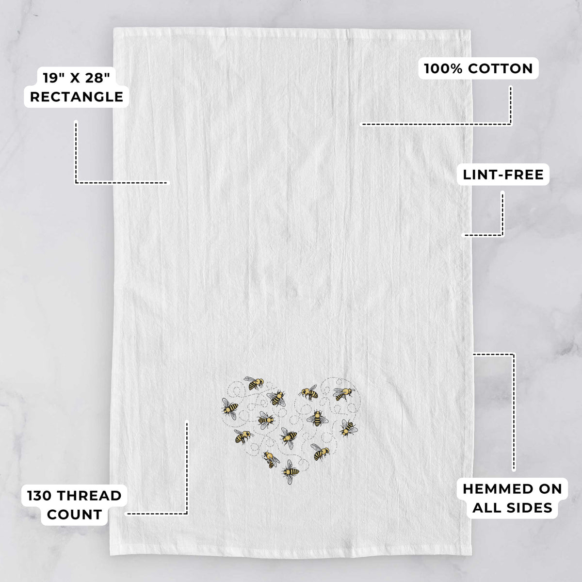 White tea towel printed with a heart shape made of small bees and looping flight trails, with feature labels: 19 by 28 inch rectangle, 100% cotton, lint-free, 130 thread count, hemmed on all sides.
