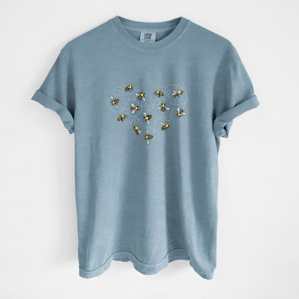 Steel blue Comfort Colors t-shirt laid flat, printed with a heart shape made of small bees and looping flight trails.