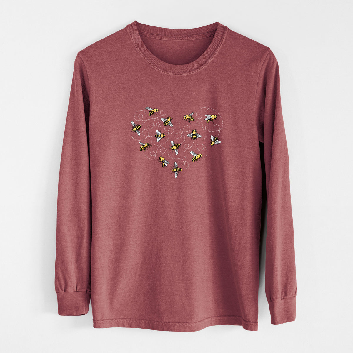 Brick red Comfort Colors long sleeve shirt laid flat, printed with a heart shape made of small bees and looping flight trails.