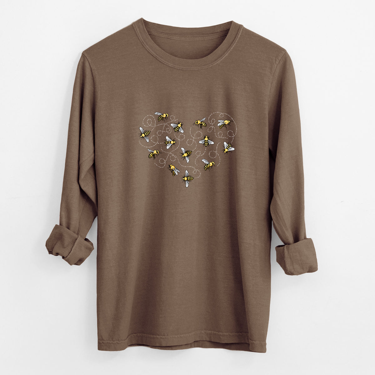 Espresso brown Comfort Colors long sleeve shirt laid flat with the cuffs rolled, printed with a heart shape made of small bees and looping flight trails.