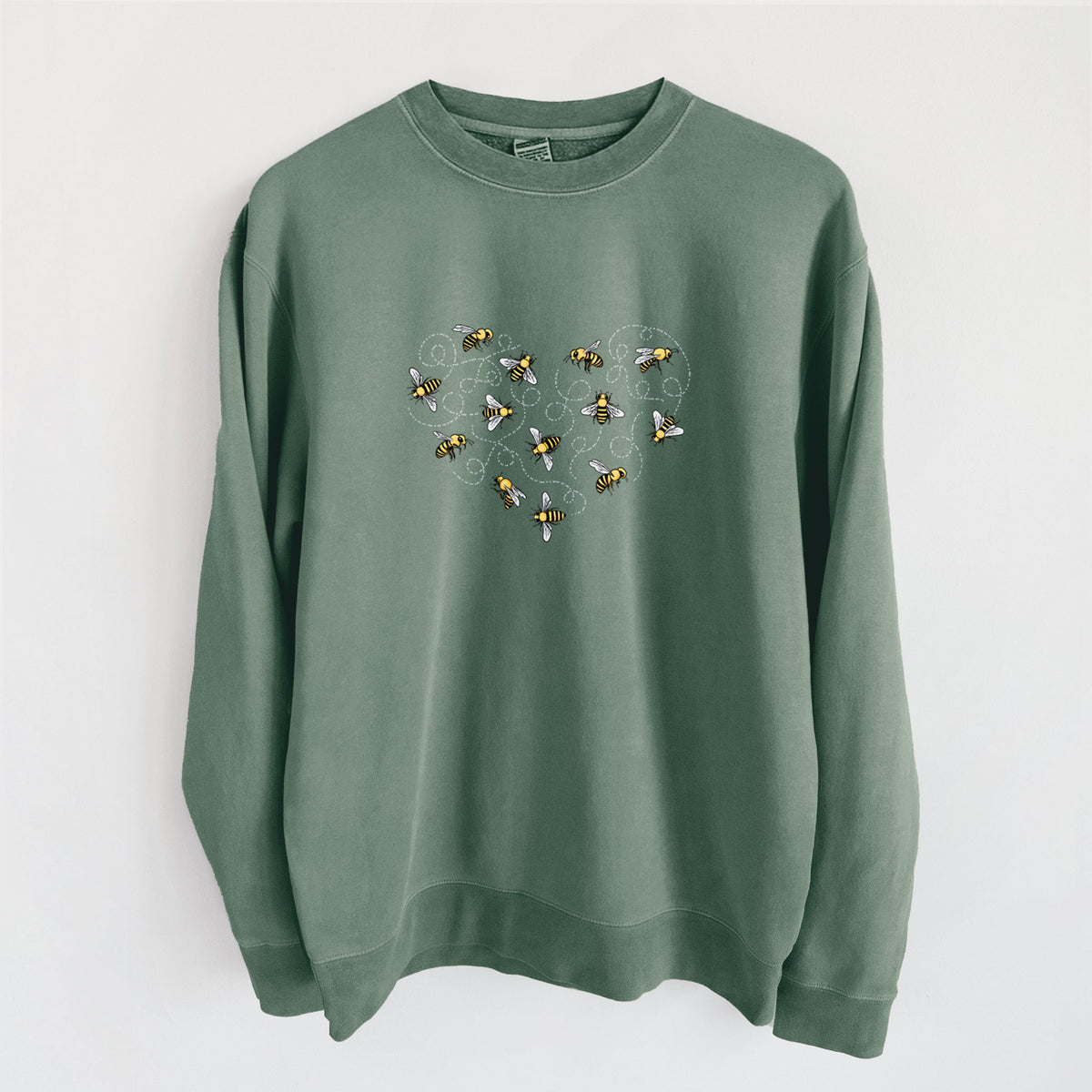 Alpine green pigment dyed crewneck sweatshirt laid flat, printed with a heart shape made of small bees and looping flight trails.