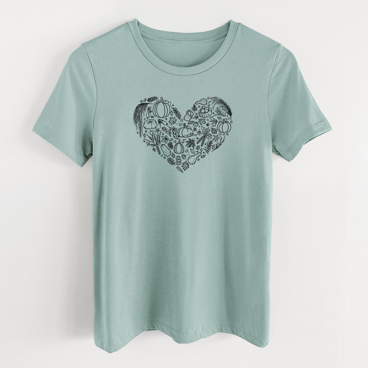 Dusty blue women's relaxed fit cotton t-shirt laid flat, printed with a heart shape filled with black ink autumn leaves, acorns, pumpkins and mushrooms.