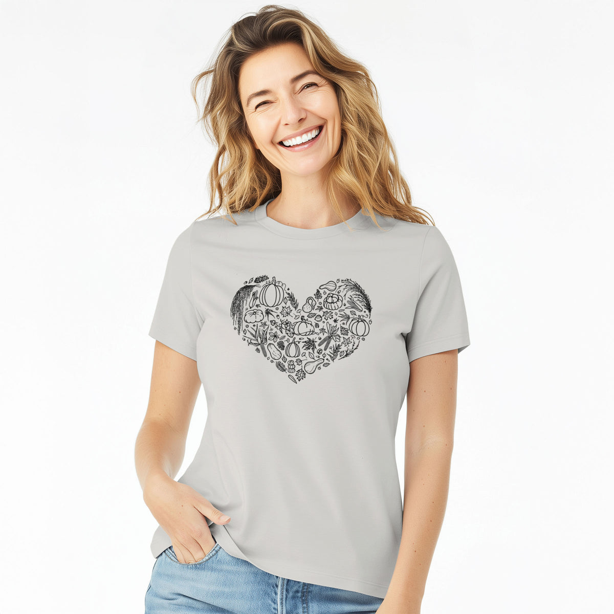 Woman wearing a lunar grey women's relaxed fit cotton t-shirt printed with a heart shape filled with black ink autumn leaves, acorns, pumpkins and mushrooms.