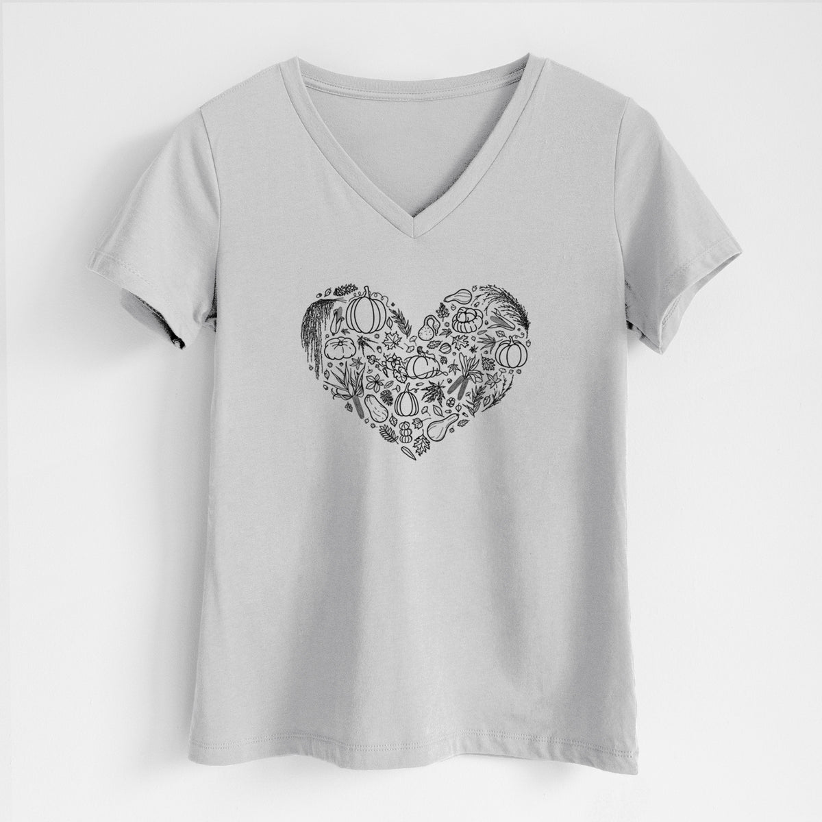 Lunar grey women's relaxed fit cotton V-neck t-shirt laid flat, printed with a heart shape filled with black ink autumn leaves, acorns, pumpkins and mushrooms.