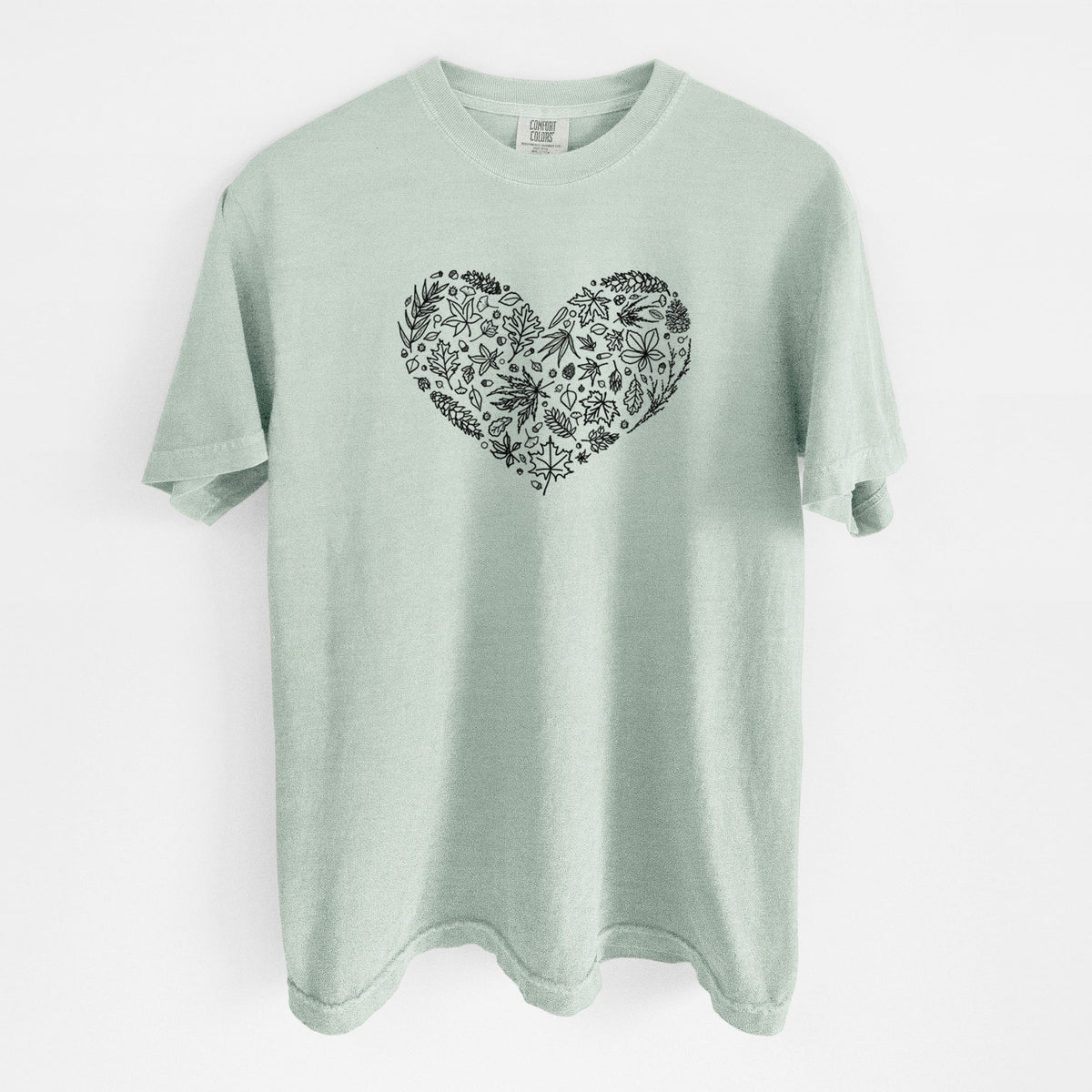 Bay green Comfort Colors t-shirt laid flat, printed with a heart shape filled with black ink autumn leaves.