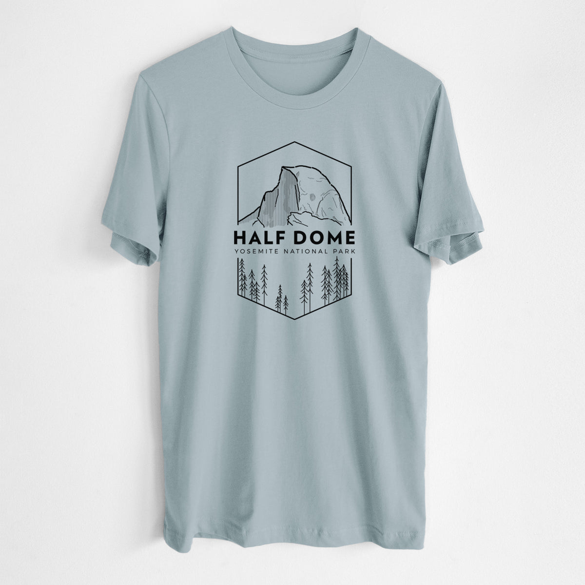 Vintage denim lightweight cotton t-shirt laid flat, printed with a black line art badge of Half Dome above a pine forest, with the words Half Dome, Yosemite National Park.