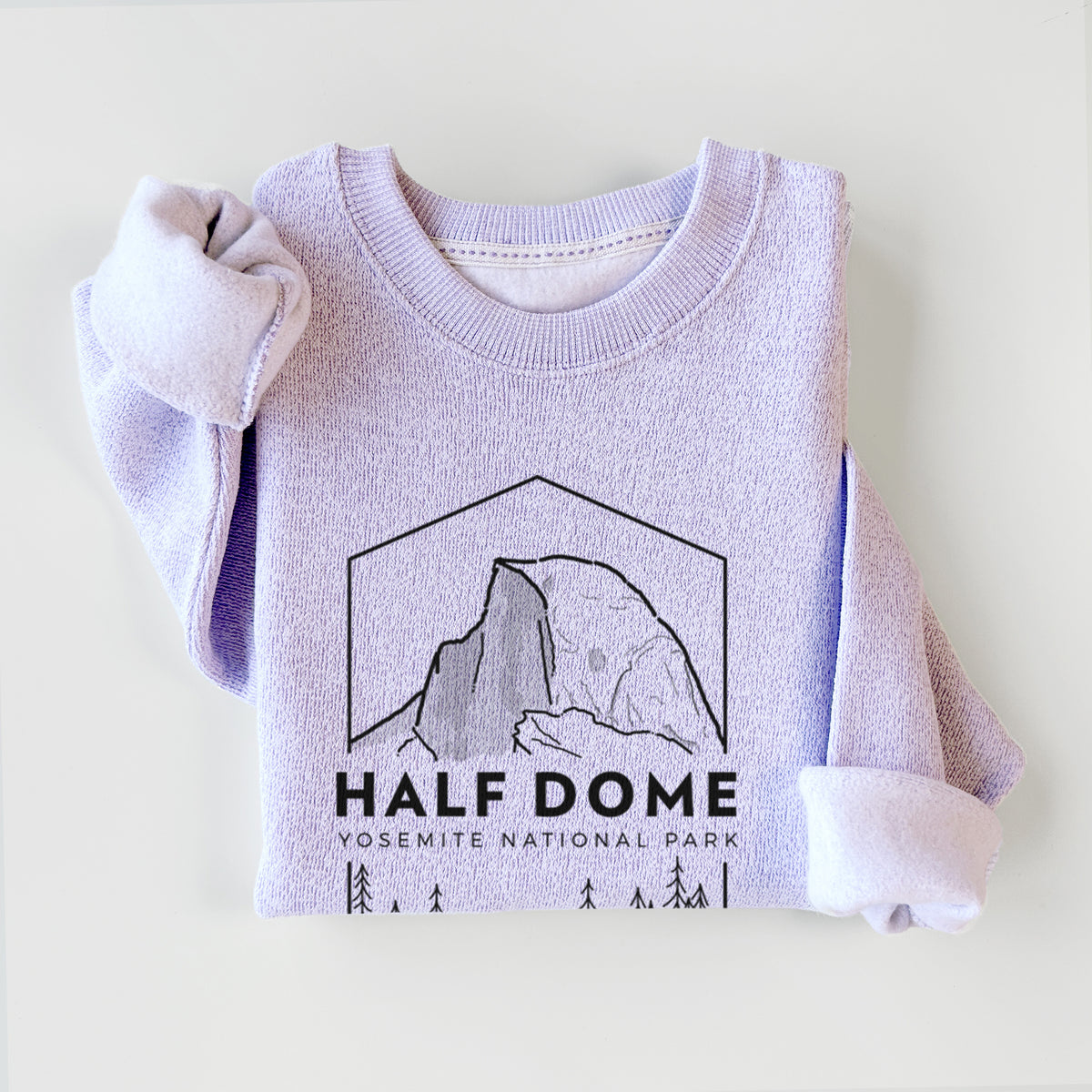 Ice purple knit sweatshirt printed with a black line art badge of Half Dome above a pine forest, with the words Half Dome, Yosemite National Park, styled flat.