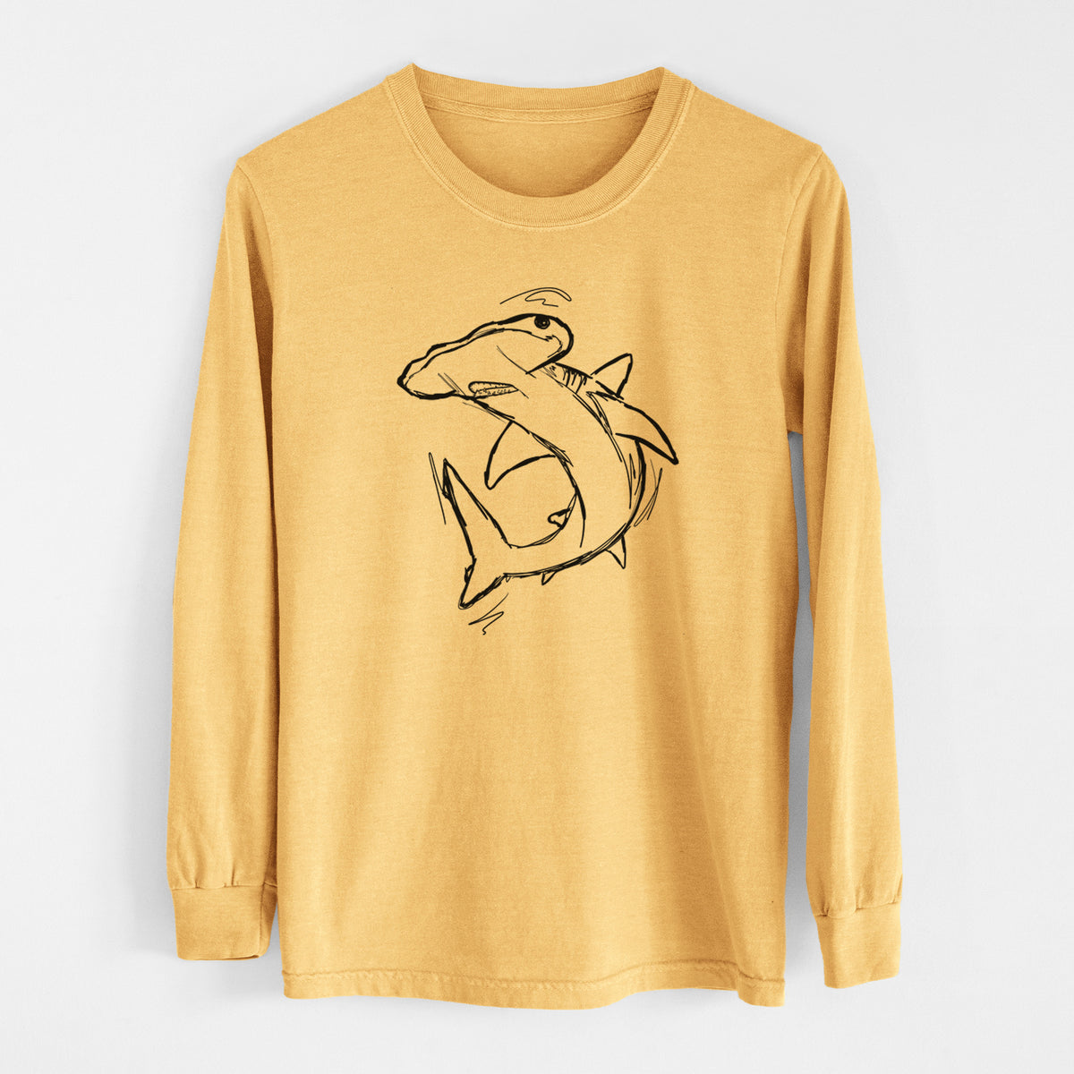 Golden wheat yellow Comfort Colors long sleeve shirt laid flat, printed with a black ink illustration of a hammerhead shark swimming in a curve.