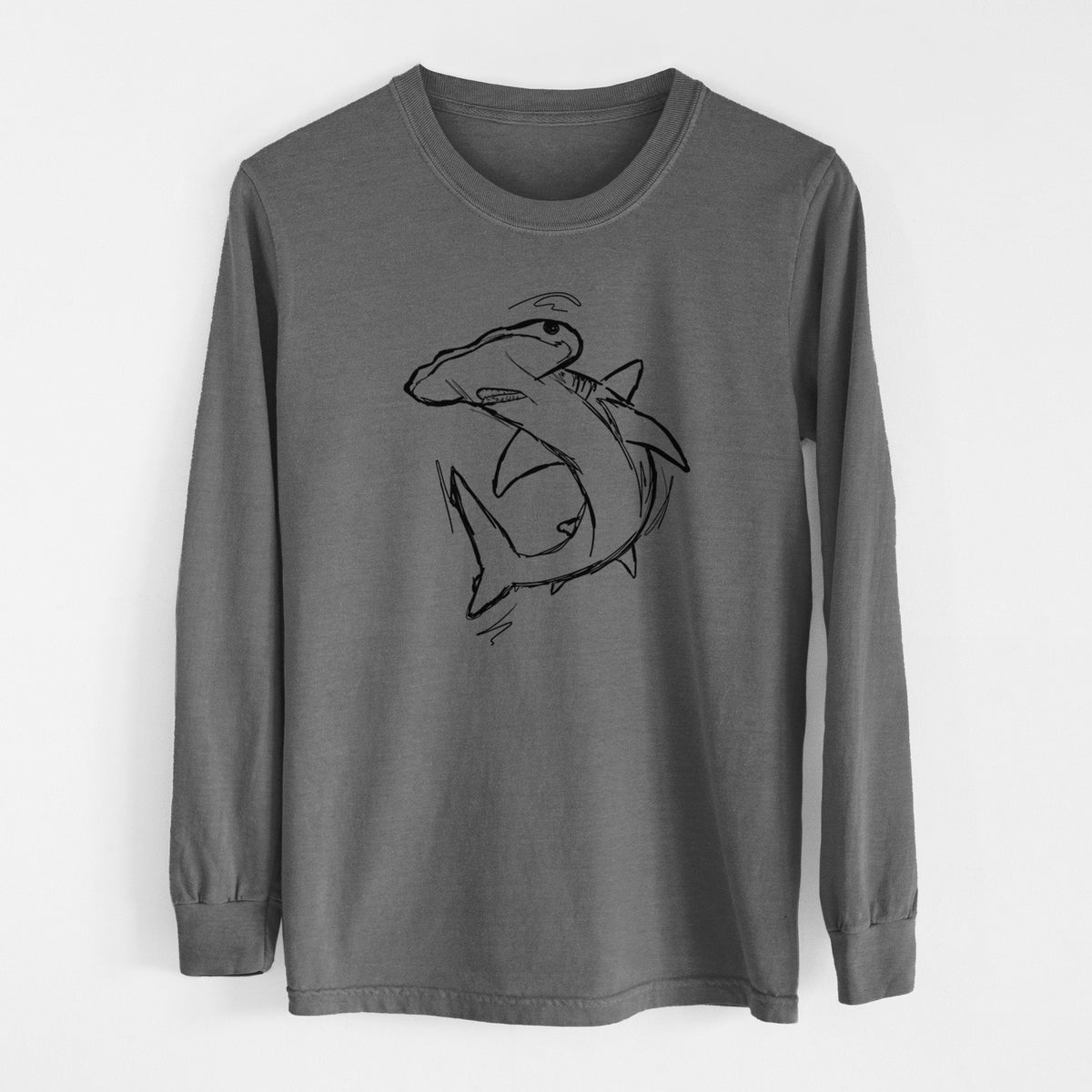 Pepper Comfort Colors long sleeve shirt laid flat, printed with a black ink illustration of a hammerhead shark swimming in a curve.
