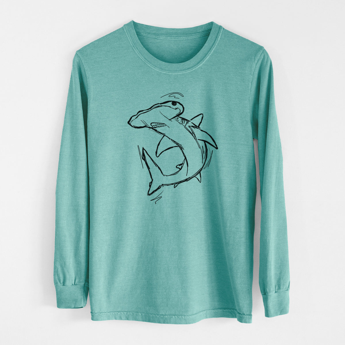 Reef green Comfort Colors long sleeve shirt laid flat, printed with a black ink illustration of a hammerhead shark swimming in a curve.