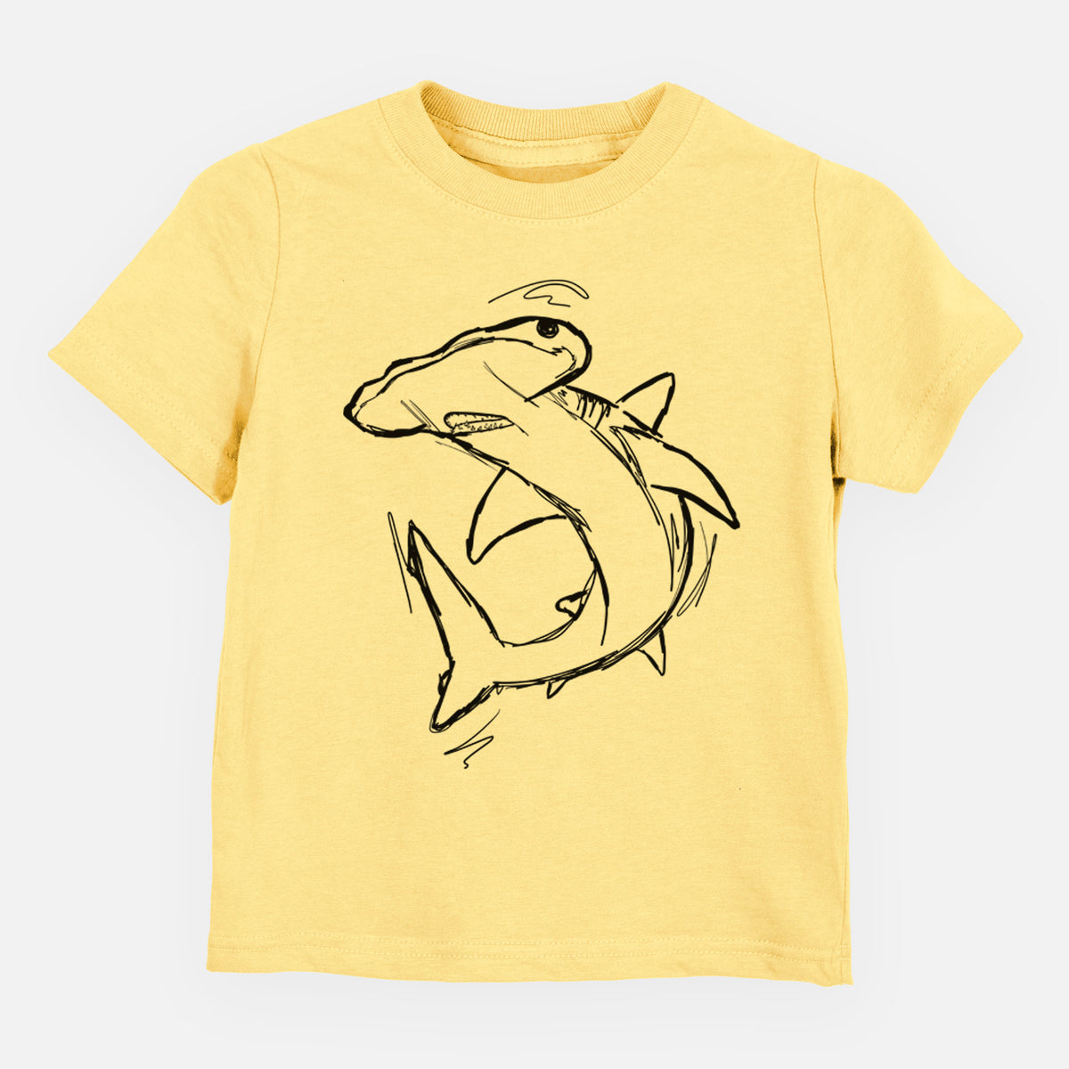 Butter yellow toddler t-shirt laid flat, printed with a black ink illustration of a hammerhead shark swimming in a curve.