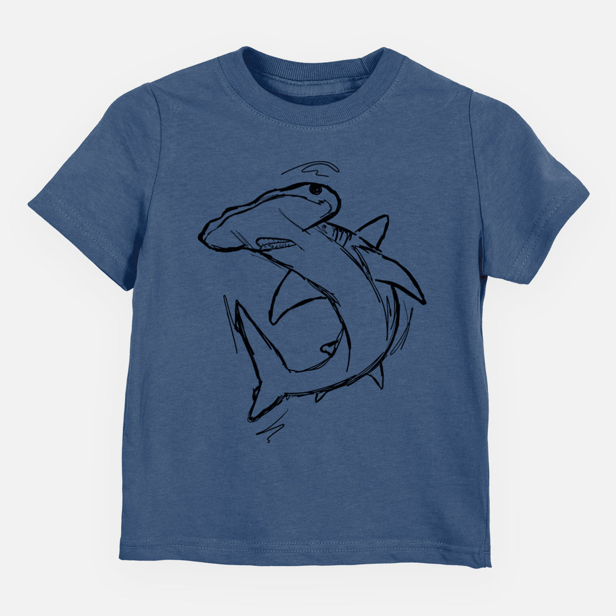 Indigo blue toddler t-shirt laid flat, printed with a black ink illustration of a hammerhead shark swimming in a curve.