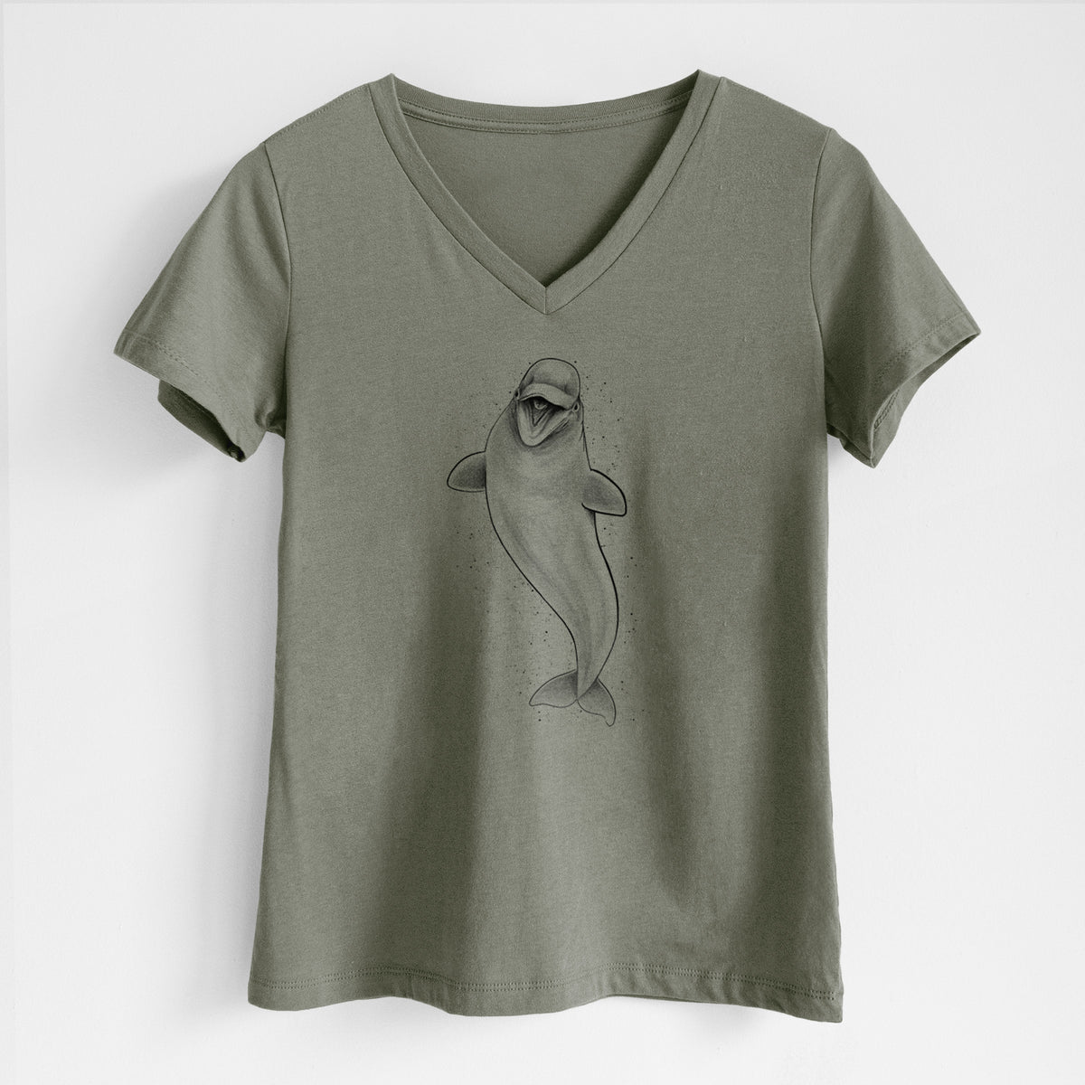 Military green women's relaxed fit cotton V-neck t-shirt laid flat, printed with a black ink illustration of a smiling beluga whale swimming upward.