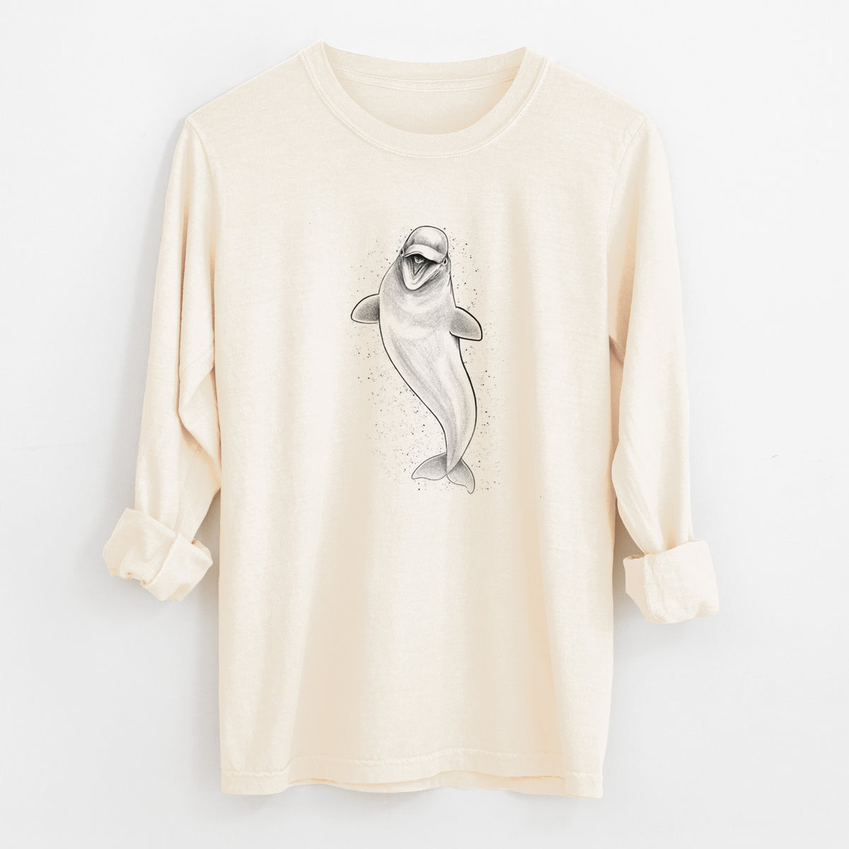 Ivory Comfort Colors long sleeve shirt laid flat with the cuffs rolled, printed with a black ink illustration of a smiling beluga whale swimming upward.