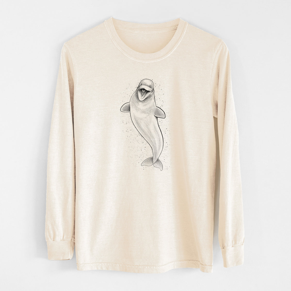 Ivory Comfort Colors long sleeve shirt laid flat, printed with a black ink illustration of a smiling beluga whale swimming upward.