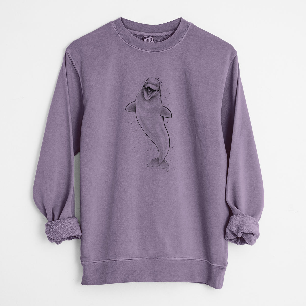Plum purple pigment dyed crewneck sweatshirt laid flat with the sleeves rolled, printed with a black ink illustration of a smiling beluga whale swimming upward.