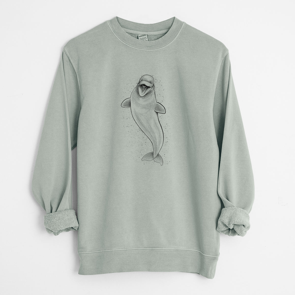 Sage green pigment dyed crewneck sweatshirt laid flat with the sleeves rolled, printed with a black ink illustration of a smiling beluga whale swimming upward.