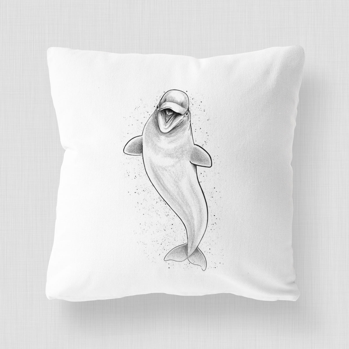 White pillow cover printed with a black ink illustration of a smiling beluga whale swimming upward.
