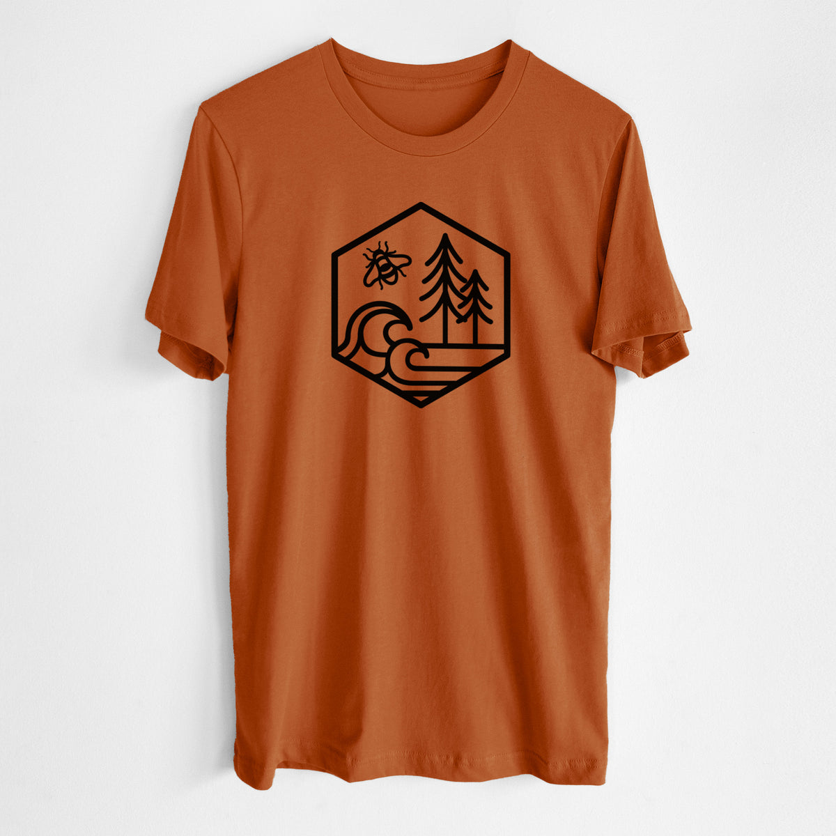 Autumn lightweight cotton t-shirt laid flat, printed with a black line art hexagon holding a bee, ocean waves and pine trees.