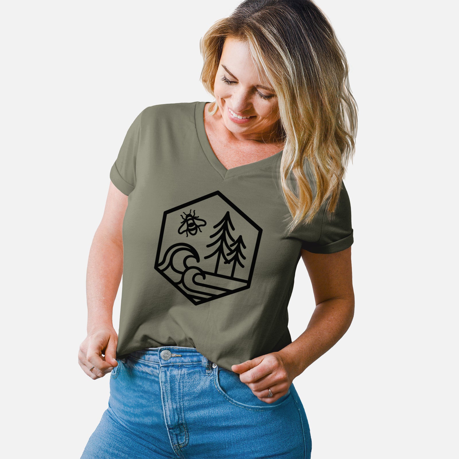 Turquoise women's relaxed fit cotton V-neck t-shirt laid flat, printed with a black line art hexagon holding a bee, ocean waves and pine trees.