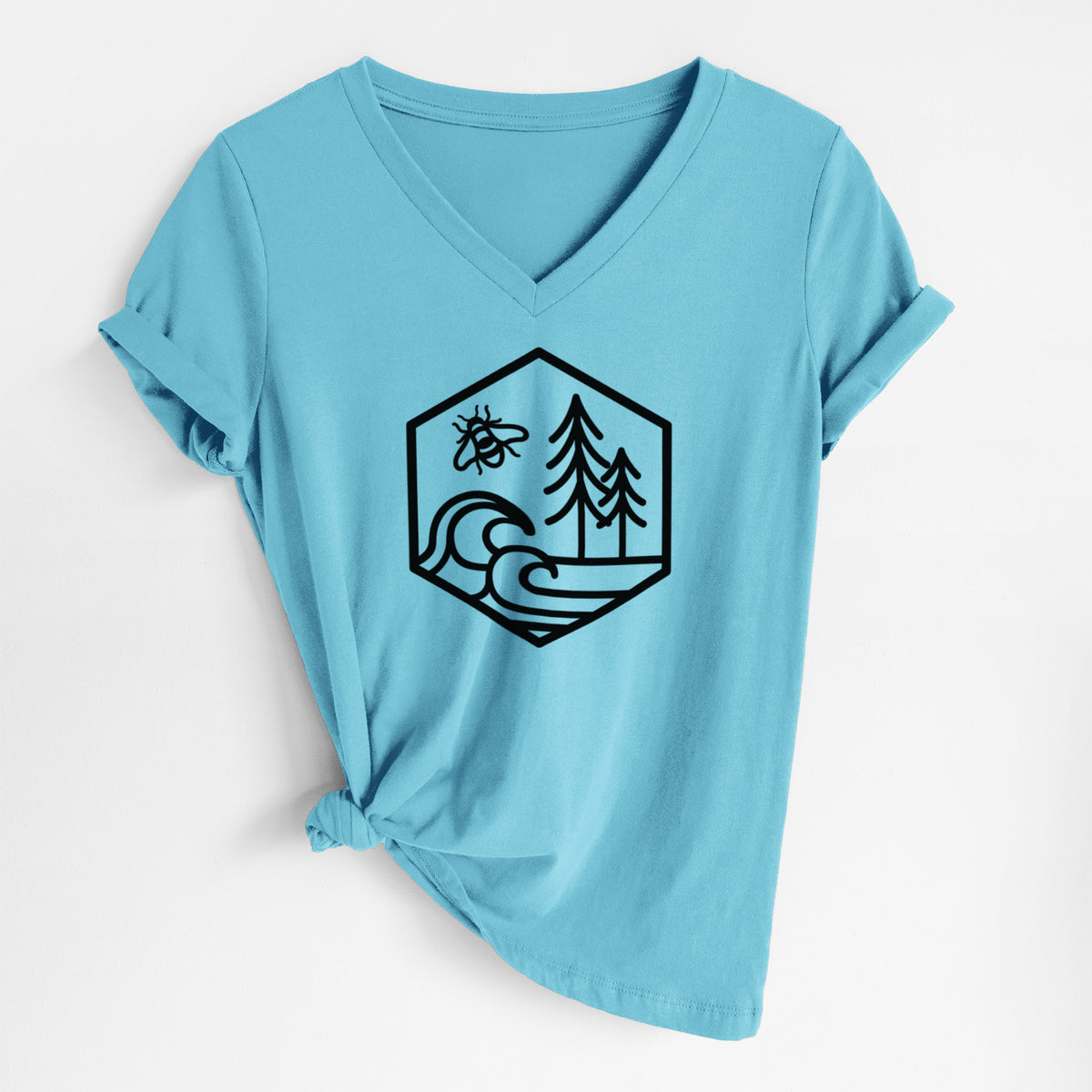 Turquoise women's relaxed fit cotton V-neck t-shirt laid flat, printed with a black line art hexagon holding a bee, ocean waves and pine trees.