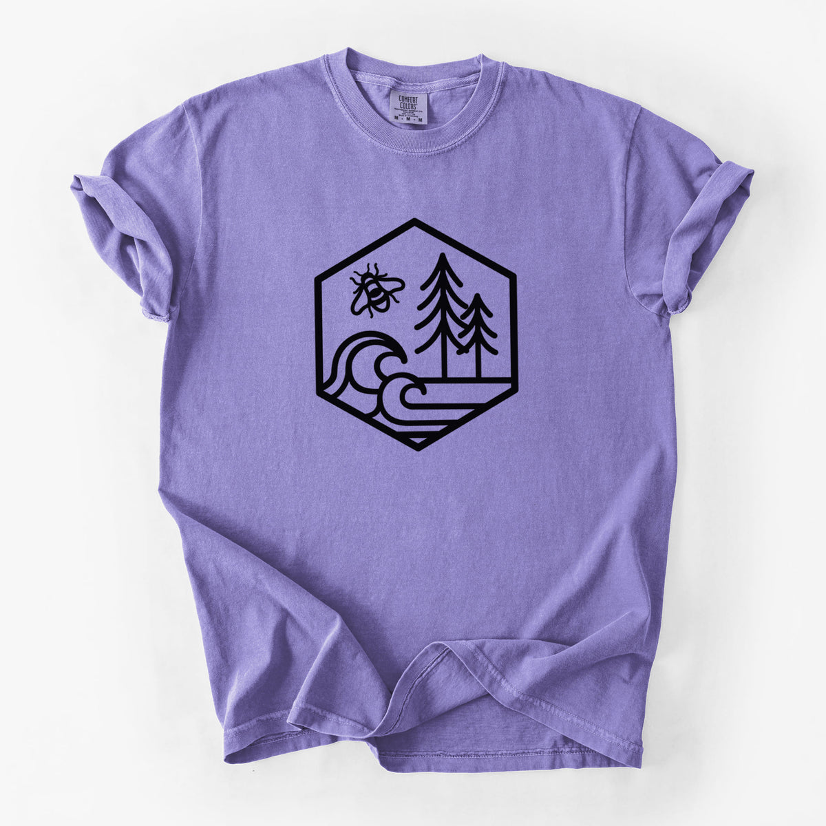 Violet purple Comfort Colors t-shirt laid flat, printed with a black line art hexagon holding a bee, ocean waves and pine trees.