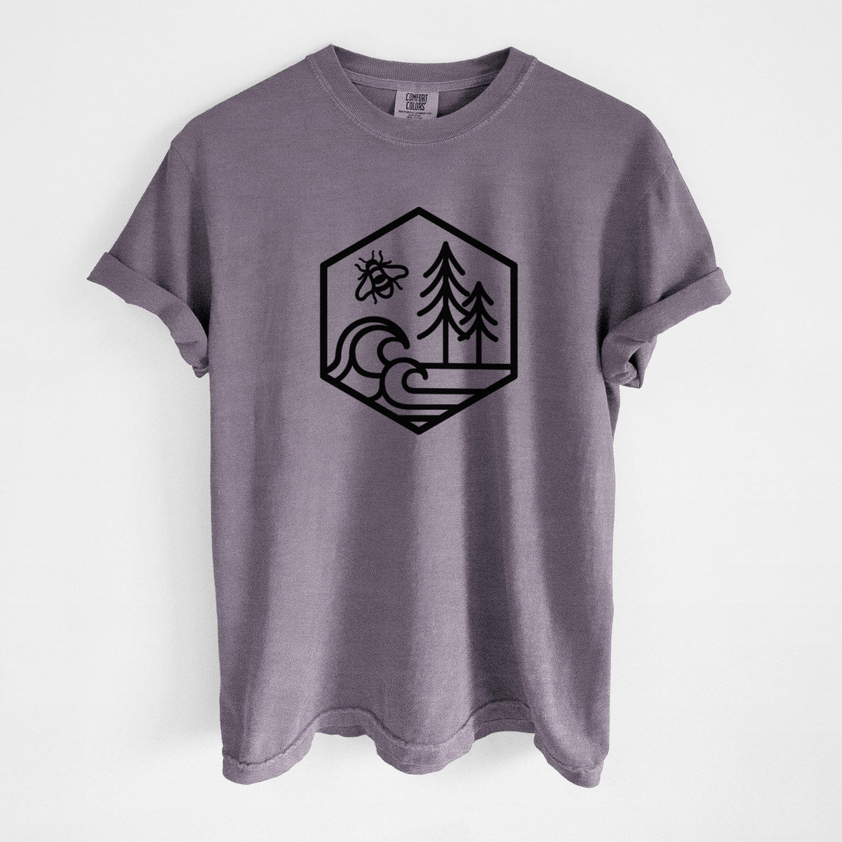 Wine red Comfort Colors t-shirt laid flat, printed with a black line art hexagon holding a bee, ocean waves and pine trees.
