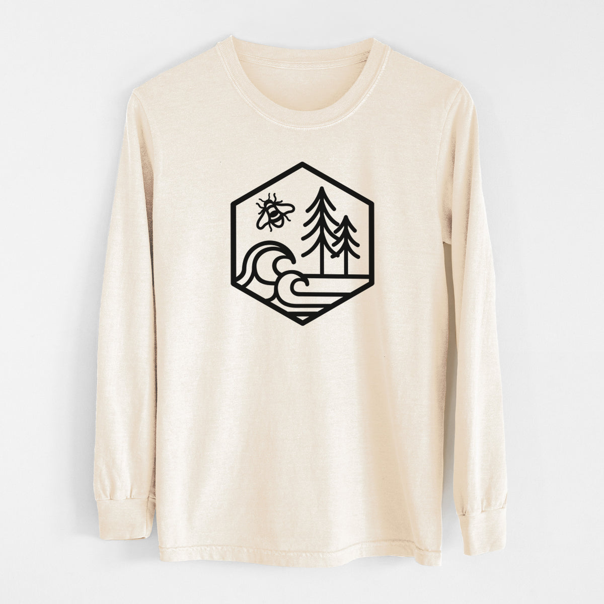 Ivory Comfort Colors long sleeve shirt laid flat, printed with a black line art hexagon holding a bee, ocean waves and pine trees.