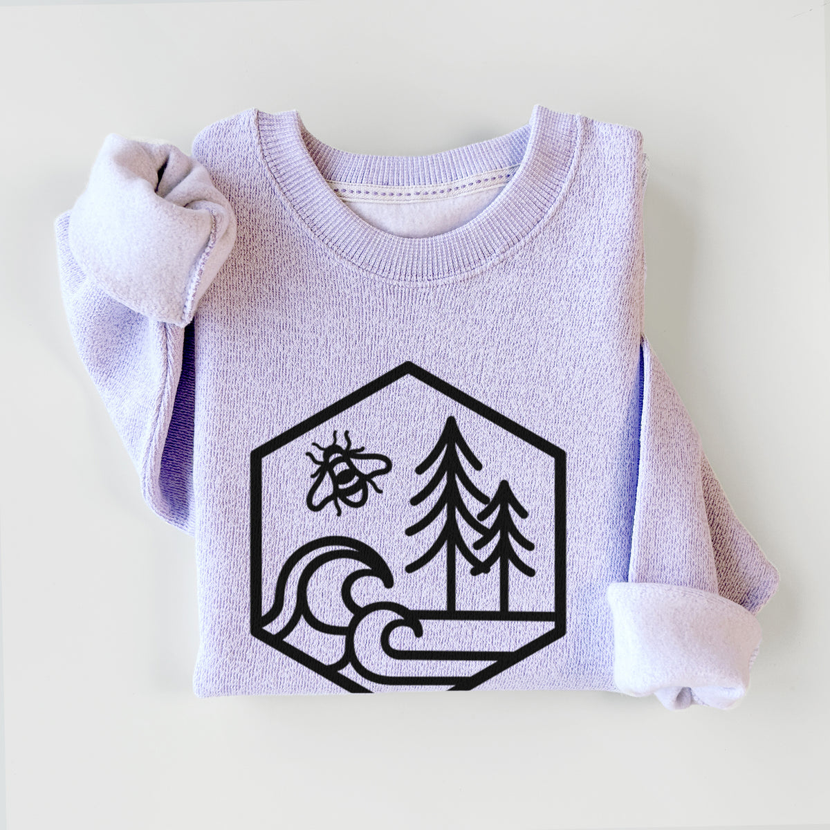 Ice purple knit sweatshirt printed with a black line art hexagon holding a bee, ocean waves and pine trees, styled flat.