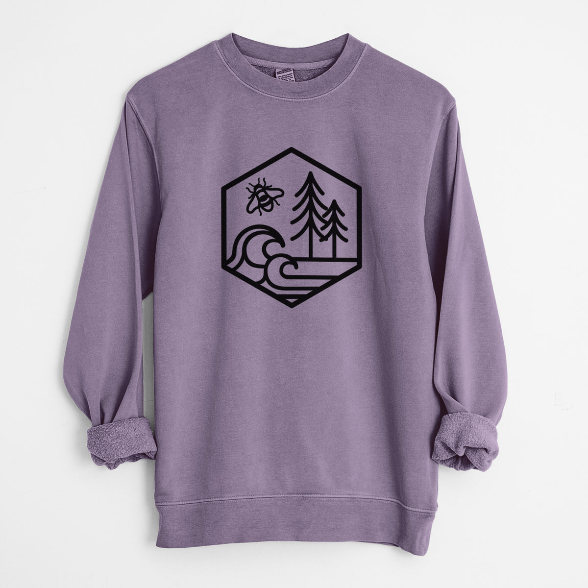 Plum purple pigment dyed crewneck sweatshirt laid flat with the sleeves rolled, printed with a black line art hexagon holding a bee, ocean waves and pine trees.