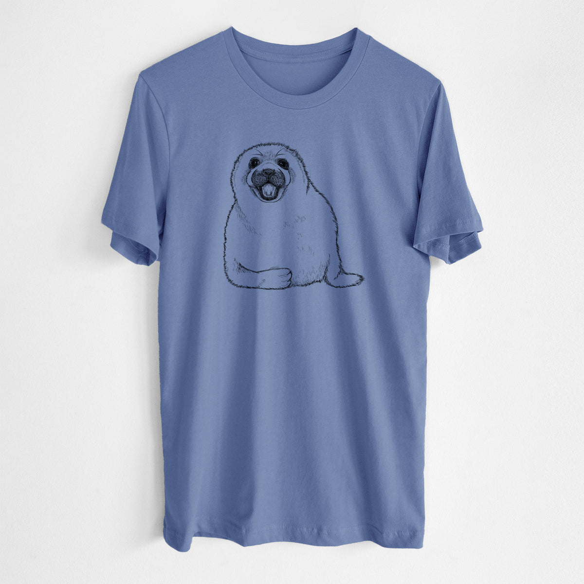 Blue bell lightweight cotton t-shirt laid flat, printed with a black ink illustration of a smiling harp seal pup lying down.