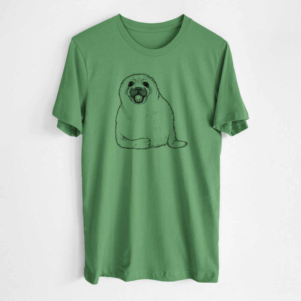 Leaf green lightweight cotton t-shirt laid flat, printed with a black ink illustration of a smiling harp seal pup lying down.