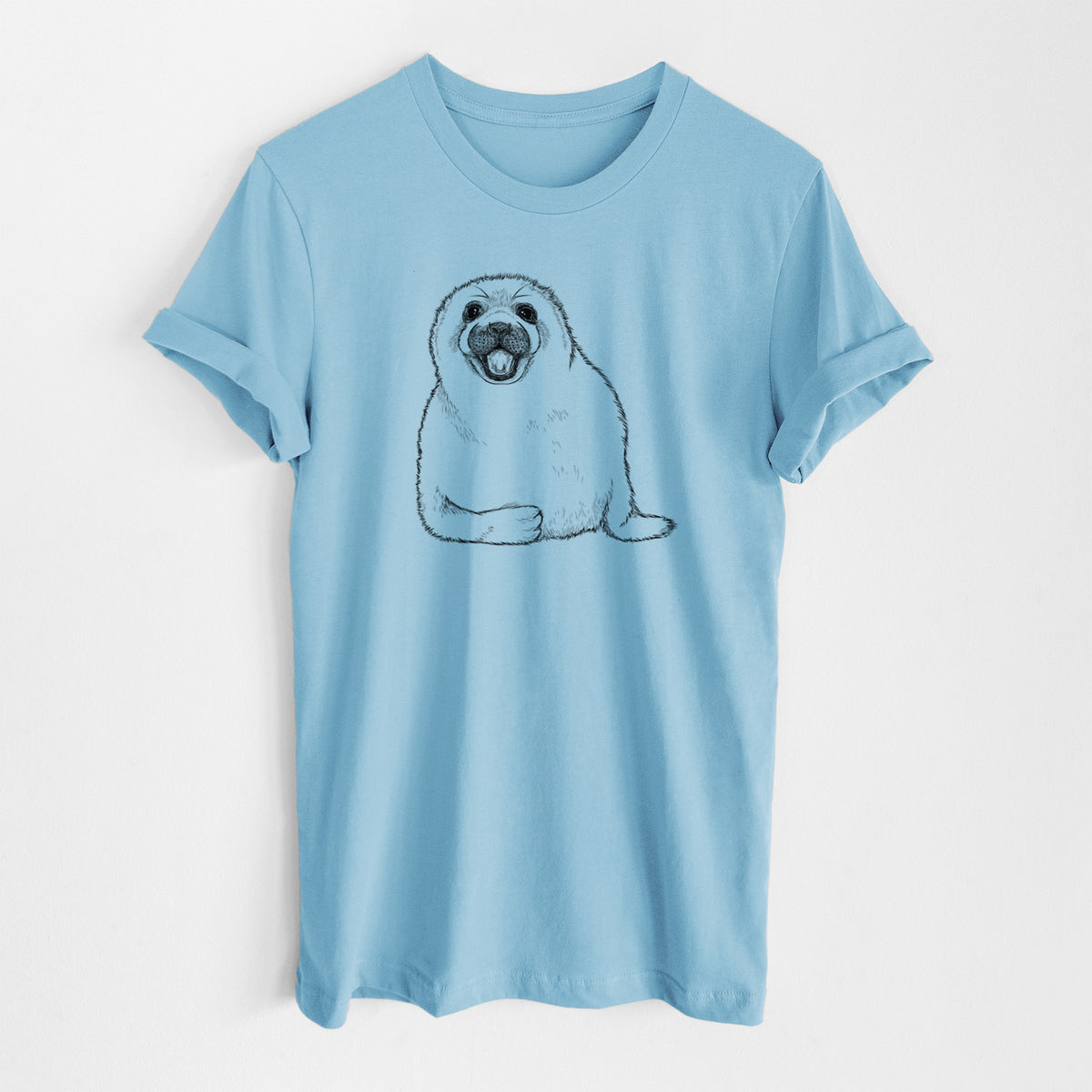 Ocean blue lightweight cotton t-shirt laid flat, printed with a black ink illustration of a smiling harp seal pup lying down.