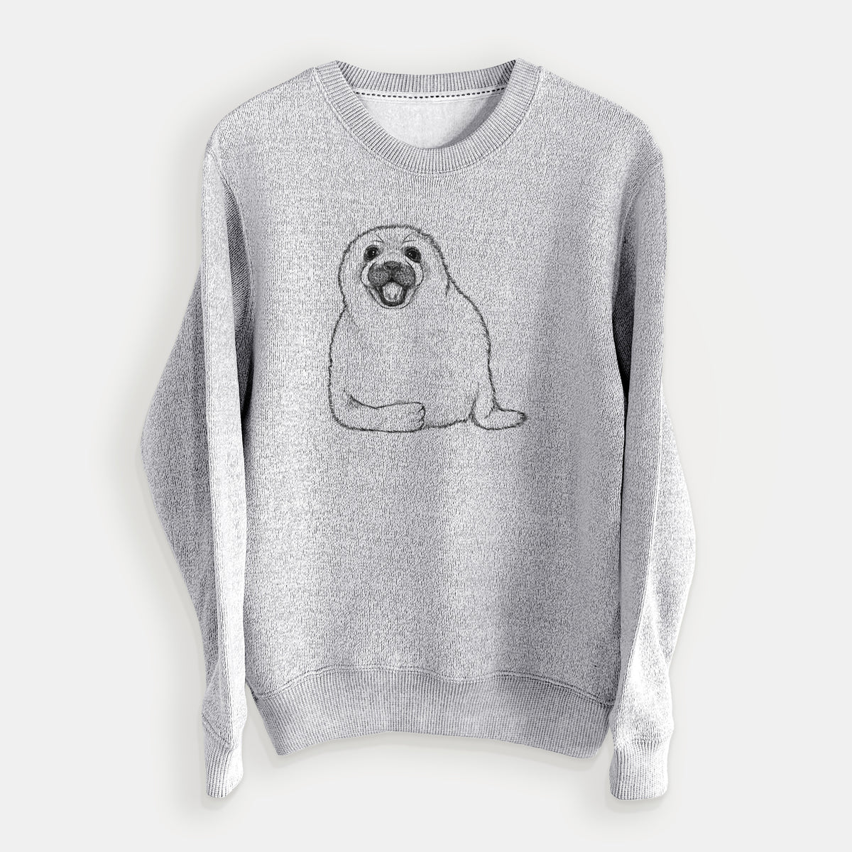Salt and pepper knit sweatshirt laid flat, printed with a black ink illustration of a smiling harp seal pup lying down.
