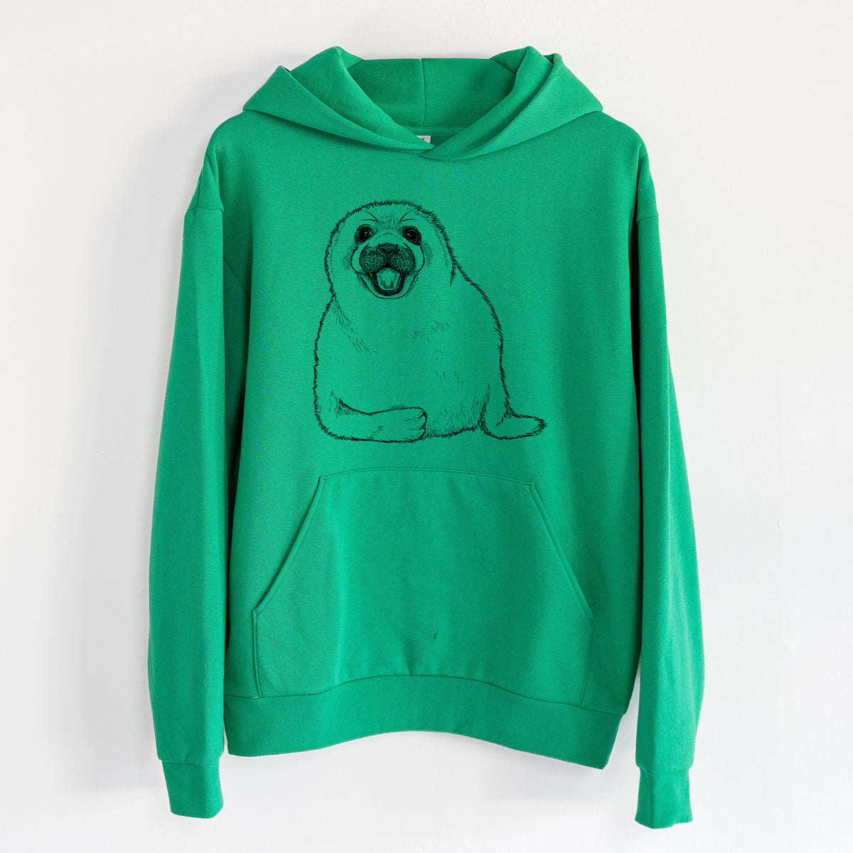 Harp Seal Pup - Pagophilus groenlandicus - Statement Midweight Hoodie in Kelly Green, hanging on a white wall, with a front kangaroo pocket and no drawcords.